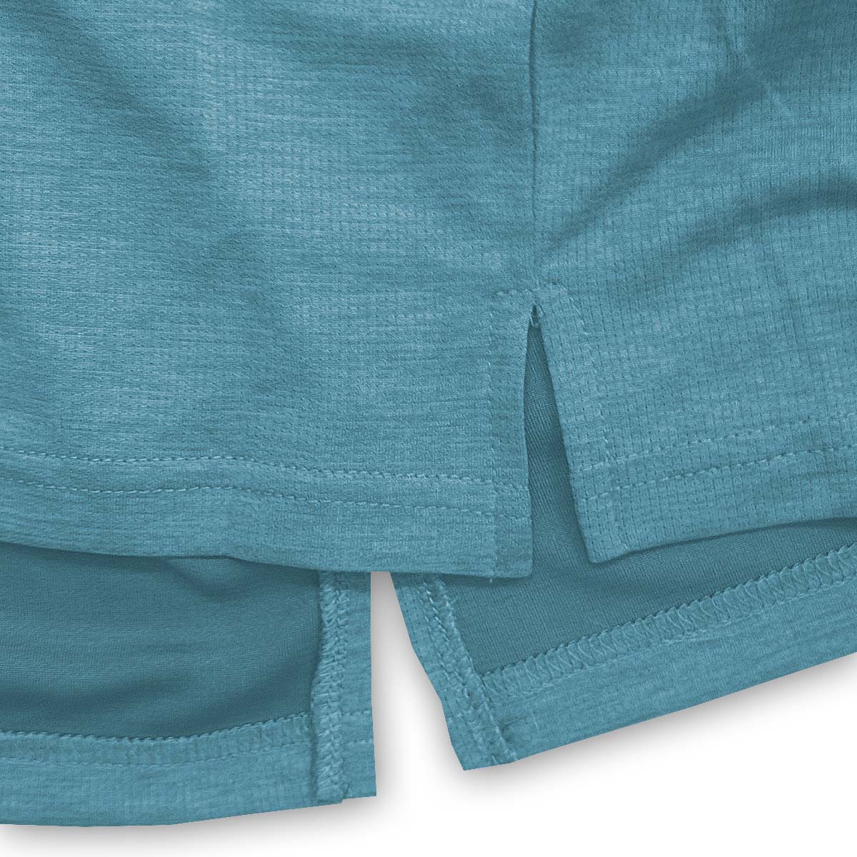 Close-up of teal shorts with a white background