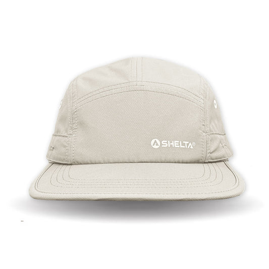 Beige cap with 'Selta' logo on a white background