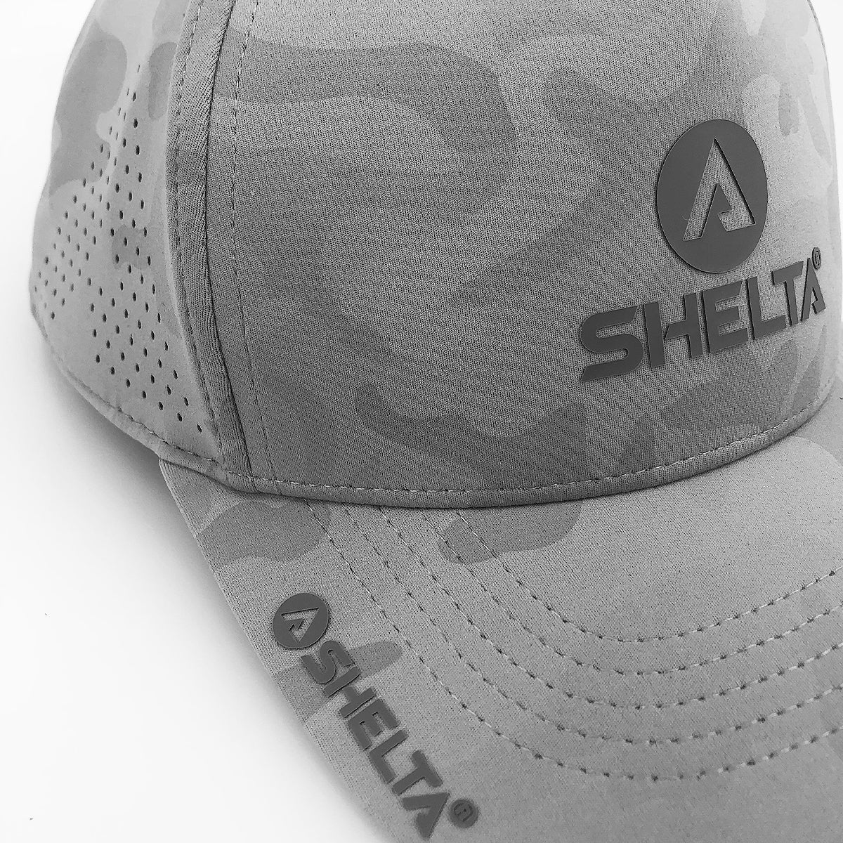 Close up of the hector cam in grey camo with shelta logos