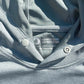 Close-up of a gray shirt with sun protection label