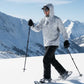 Person snowshoeing in a snowy mountain landscape