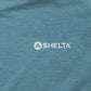 Close-up of a blue fabric surface with a Shelta logo.