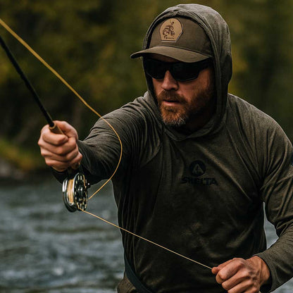 Man fishing with a shelta sun shirt and shelta cap