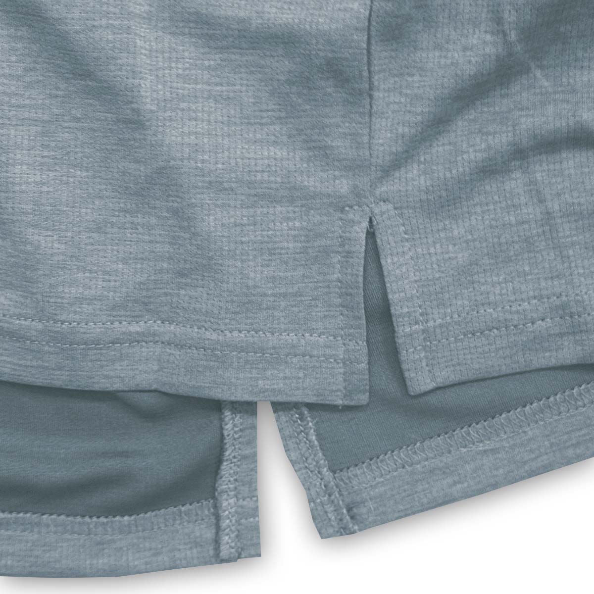Close-up of blue shorts with a textured pattern on a white background