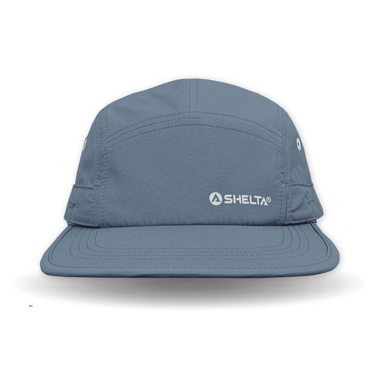Blue cap with Shelta logo on a white background