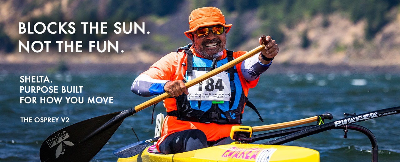 A man wearing an orange hat, orange life vest, and sunglasses paddles a yellow kayak on the water. Large text on the left reads 'BLOCKS THE SUN.