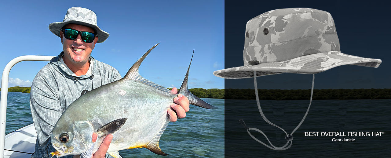 Man holding a fish on a boat with a close-up of a camouflage shelta fishing hat.