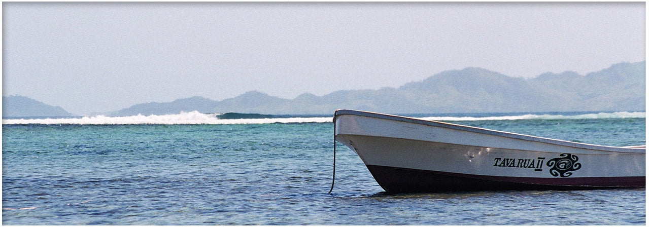 Picture of Tavi Boat with Restuarants in the background