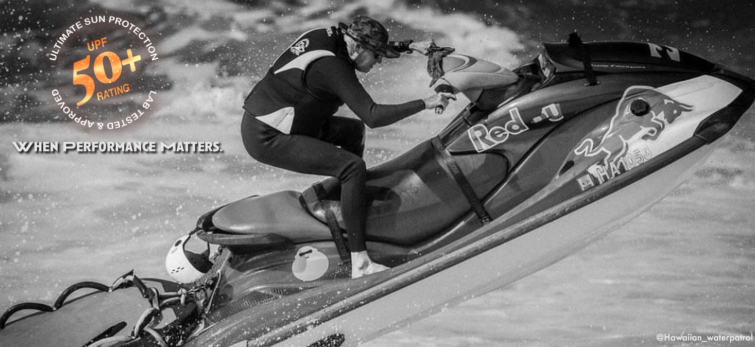 Picure of jet skier wearing a shelta sun hat in action jumping over a big wave