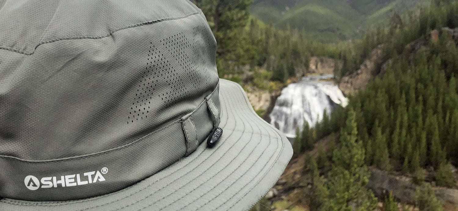 Picure of the side of a Land Hawk sun hat looking over a waterfall