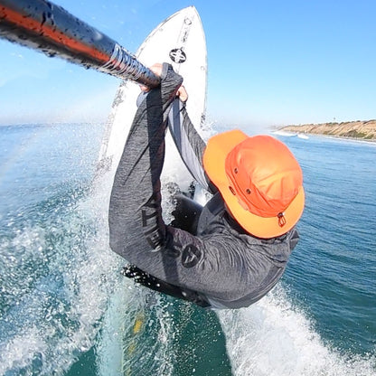 STAND UP PADDLE SURFER HITTING THE LIP IN A SHELTA OSPREY