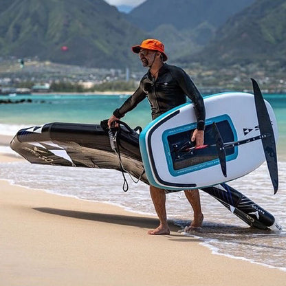 MAN WEARING SHELTA OSPREY IN ORANGE HOLDING A FOIL
