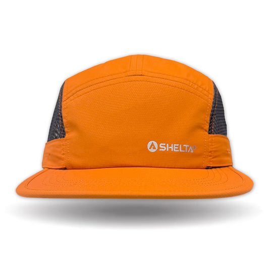 Orange running hat with mesh back on a white background, featuring the Shelta logo.