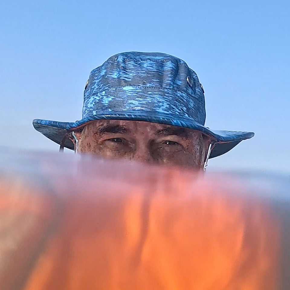 a view of the shelta seahawk sun hat while being worn in the water by a half submerged man