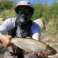 Fisherman wearing shelta Osprey sun hat and face gaiter