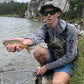 Fisherman holding trout wearing Shelta Osprey Hat with Sun Shirt