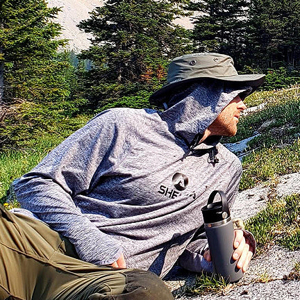 Man relaxing wearing Shelta Sun Hat and Shelta Sun Shirt