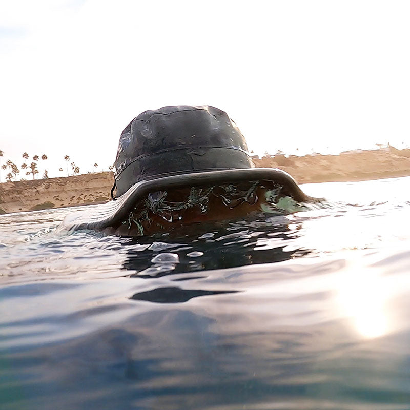 Image of Land Hawk coming out of water with water dripping down.